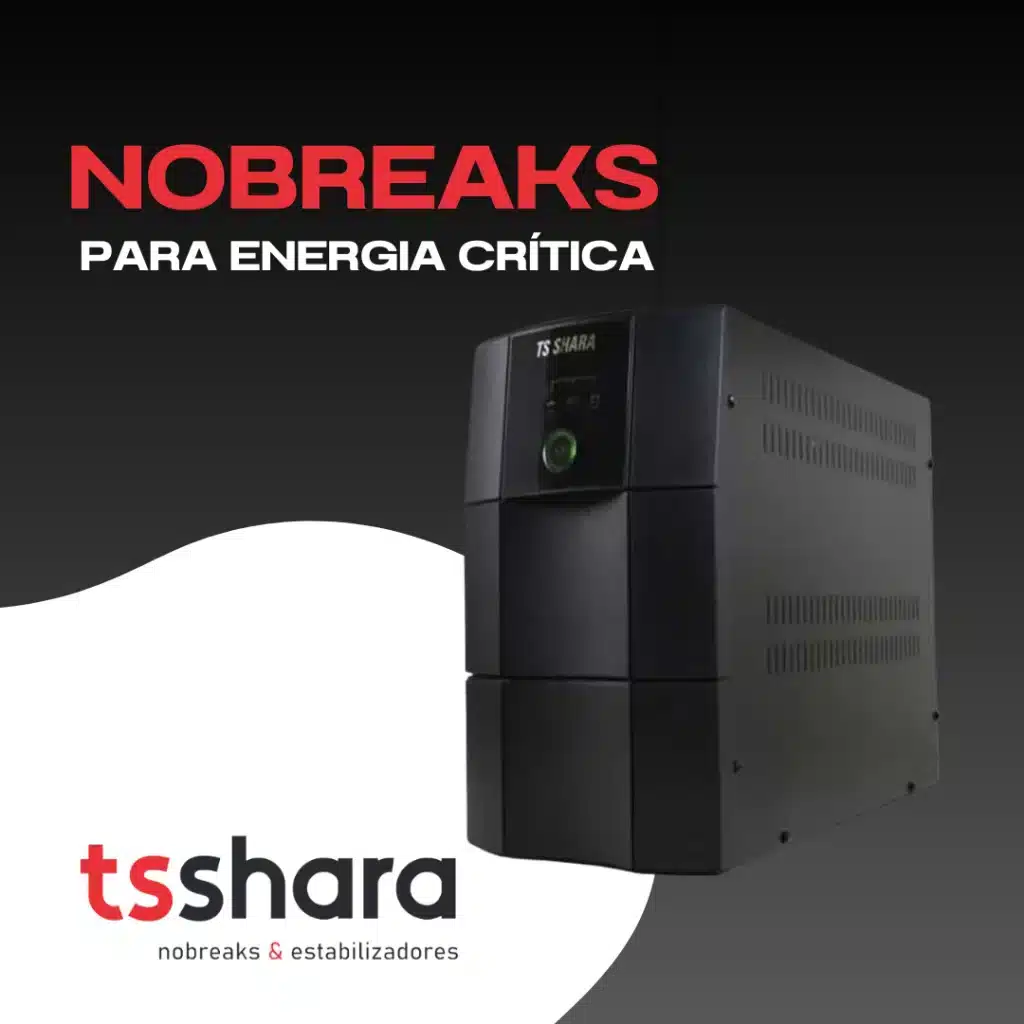 nobreak retangular preto da marca TS Shara, posicionado horizontalmente sobre uma superfície refletiva escura. O equipamento possui um design robusto com acabamento fosco e o logotipo da marca em destaque na parte frontal esquerda. À direita, há um painel com um botão de liga/desliga circular e indicadores de LED.